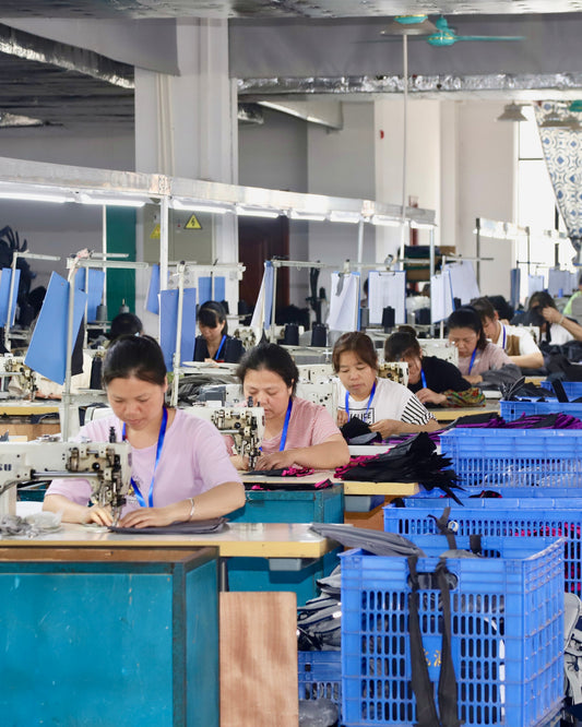Workers sewing custom bags at OPACK’s Shenzhen production facility in China